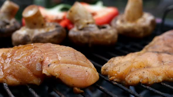 Frying Marinated Chicken Breast Steak Cooked on Grill or Barbecue Grid