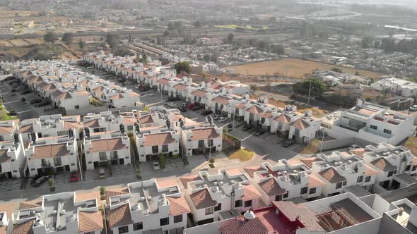 Aerial view of house buildings with street in a residential area at Alta California, Mexico - drone