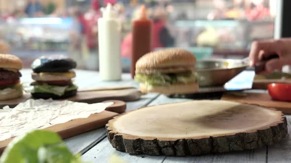 Wood Board and Three Burgers.