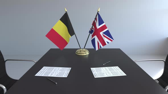 Flags of Belgium and Great Britain and Papers