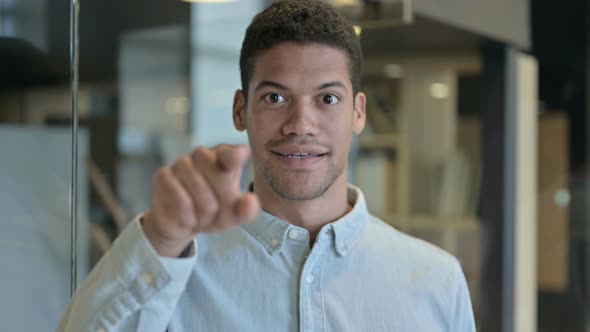 African Man Pointing Finger and Inviting with Hand Gesture