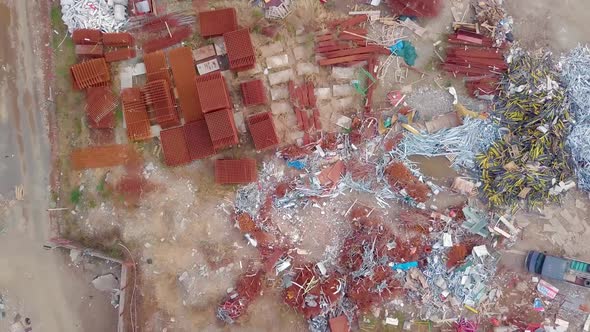 bird's-eye view of demolition site of building. concrete and rebar are visible.