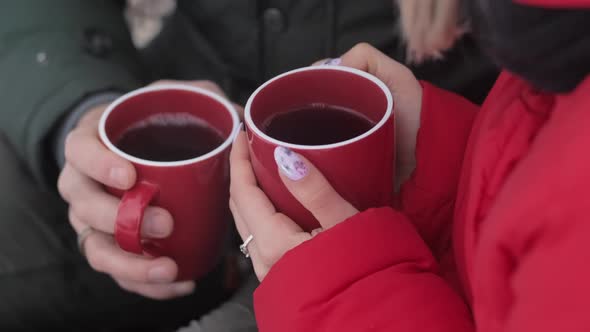 Young Couple Drinking Tea on Date in Winter Day
