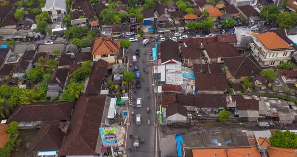 Aerial Dolly Into Overhead View of a Typical Car and Motorcycle Traffic at Intersection in Canggu