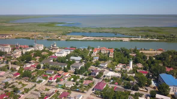 Aerial View Of Sulina City Harbor And The Danube Flowing Into The Black Sea