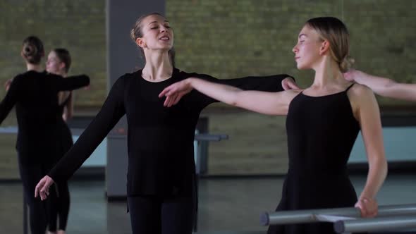 Elegant Choreographer Teaching Dancers in Ballroom