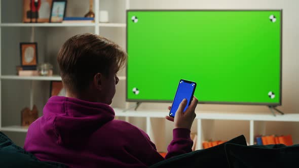 Man Watching Television in Living Room