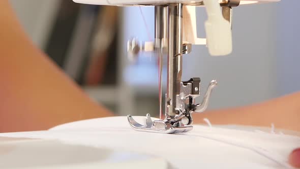 Needle Pierces the Fabric. Slow Motion