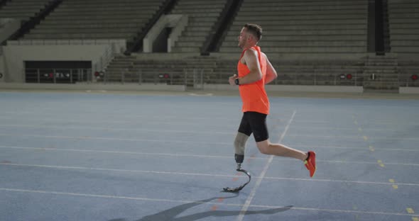 Caucasian disabled male athlete with prosthetic leg training, running