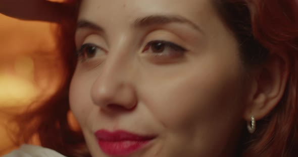 Very close-up of an Italian girl with red lipstick