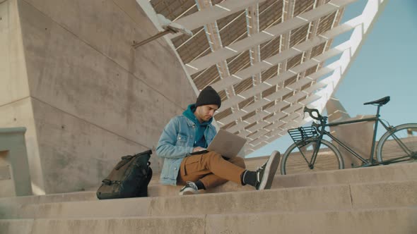 Student or Freelancer Work on Laptop Outdoors