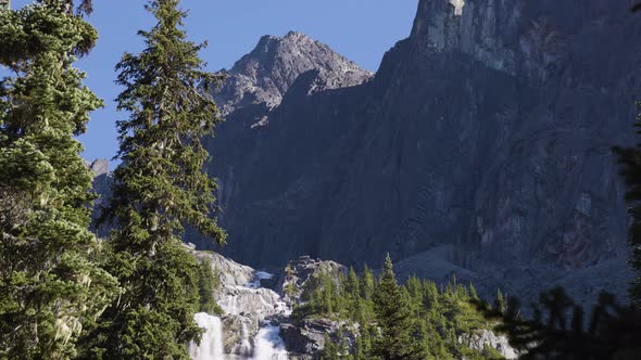 Waterfall Cascading Down a Rocky Mountain Cliff in Canadian Nature Landscape