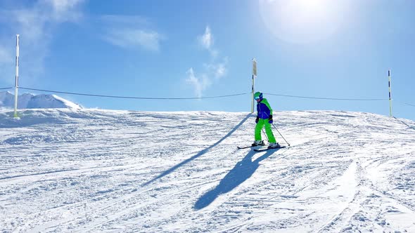 Happy Smiling Boy in Sport Helmet and Mask Ski Downhill