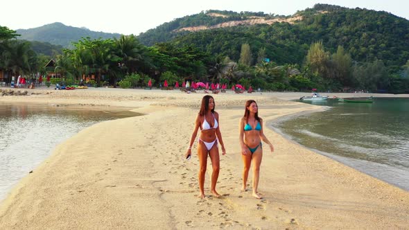 Female models happy together on perfect island beach journey by blue sea with white sand background 