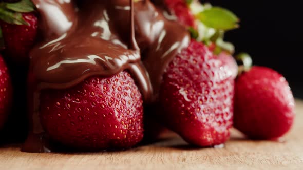 Strawberry in Melted Chocolate Closeup Melting Chocolate Bar for Fondue