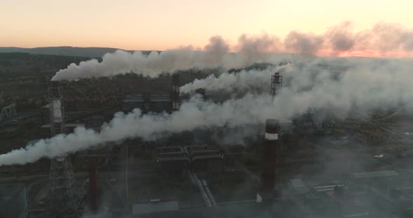 Pollution of the Environment by the Metallurgical Plant. Top View of Smoking Smokestacks. 