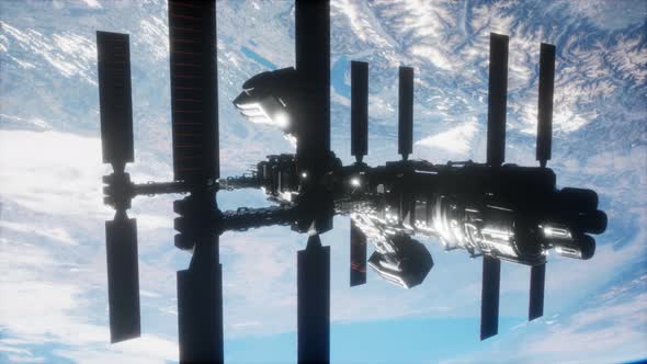 International Space Station in Outer Space Over the Planet Earth alt