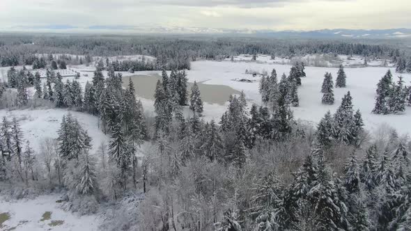 Ariel footage of snow covered landscapes.