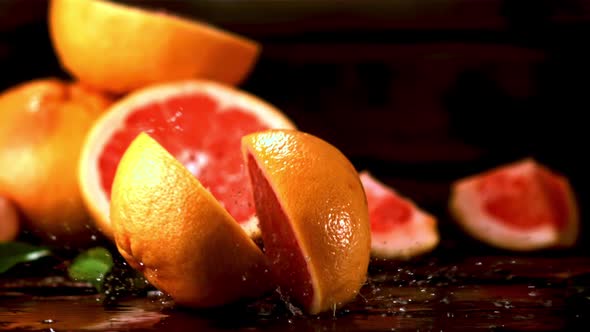 Super Slow Motion Fresh Grapefruit Falls on the Table and Splits in Two