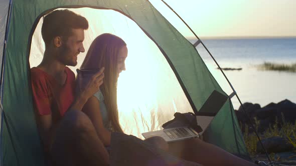 Couple Making Online Video Call During Camping