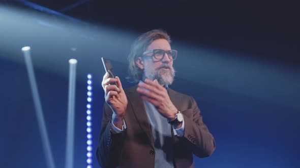 Presenter Demonstrating a New Smartphone