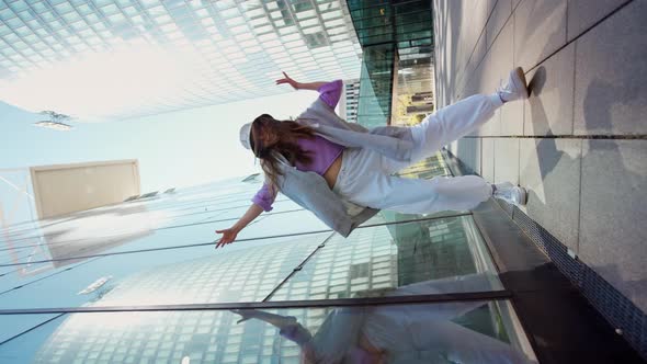 Fashionable Funky Caucasian Girl Dancer in Sportswear is Performing Outdoor Street Dancing Motion