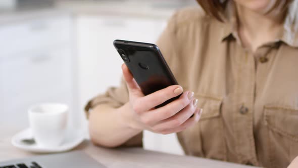 Unrecognizable Woman Using Smartphone and Credit Card