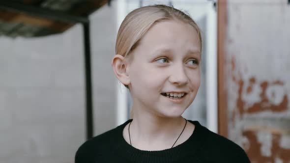 Portrait of a Cute Girl Talking to the Camera