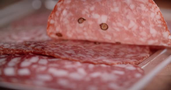 Woman Takes Thin Slice of Salami By Fingers in Slow Motion