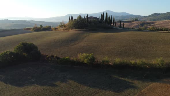 Val d'Orcia Rolling Hills and Farmhouse in Countryside Tuscany Aerial View