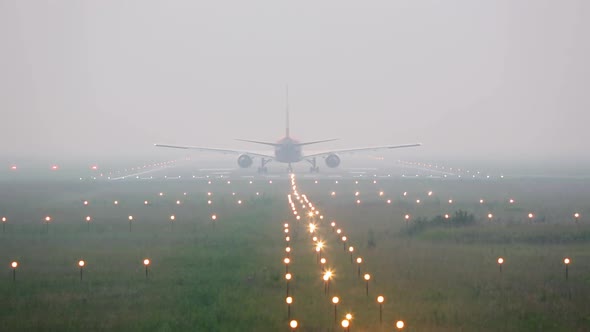 Airplane on the Runway in Heavy Fog