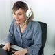 Attractive european blonde woman in headphones listening music and dancing sitting on comfy chair - VideoHive Item for Sale