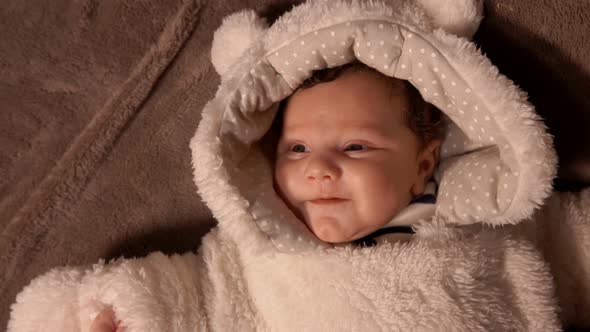 Baby in Plush Teddy Bear Custume Lay on the Blanket