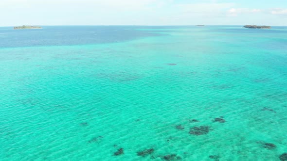 Aerial: flying over exotic tropical island secluded destination away from it all