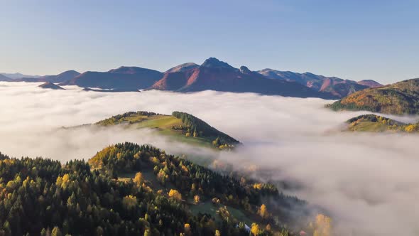Aerial Foggy Autumn Mountains Landscape in Alpine Nature at Sunrise