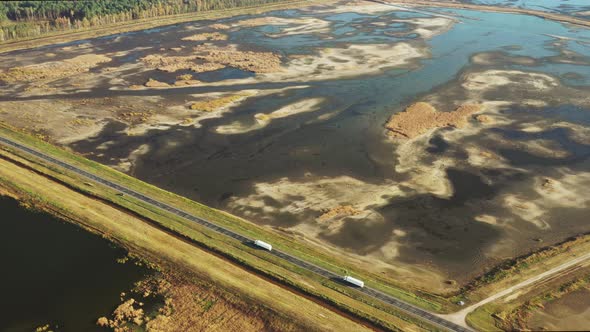 Aerial View Of Highway Road Through Ponds Autumn Landscape
