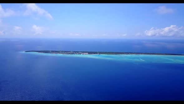 Aerial tourism of exotic resort beach lifestyle by transparent sea with white sandy background of a 
