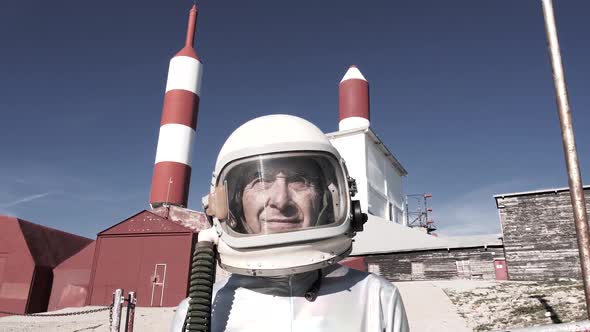 Cosmonaut against rocket shaped antennas