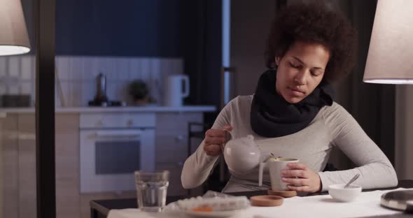 Sick Black Woman Pouring Tea