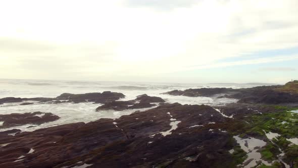 View of waves crashing on coastline