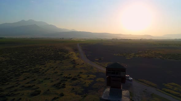 Aerial View Car Driving At Sunrise