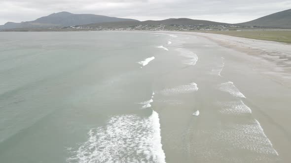 Flying Over Calm Waves Of Keel Beach On Achill Island, County Mayo, Ireland. Aerial Drone Shot