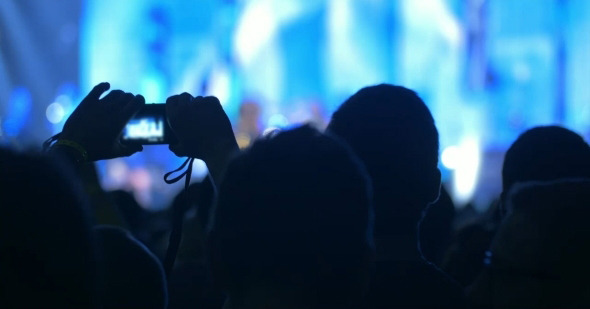 People Takes Photos On Night Concert alt