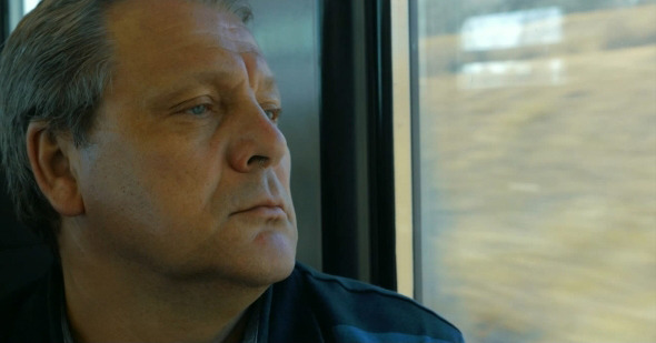 Senior Man Travelling By Train alt