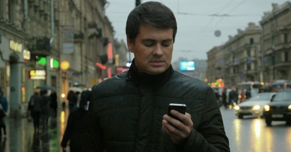 Man Using Smartphone On The Street
