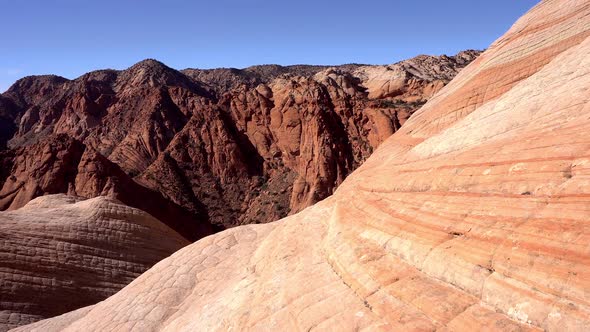 Moving over desert landscape viewing the colorful layers  of sandstone