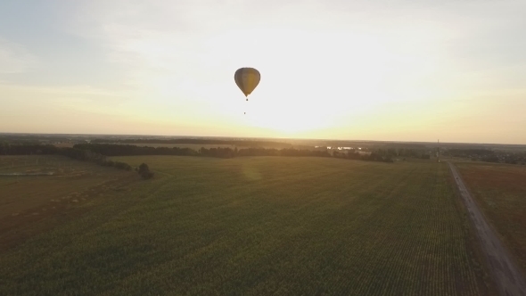 Flying a Balloon At Sunset