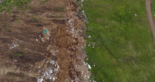 Environmental Pollution - Garbage Dump In The Field - aerial top down