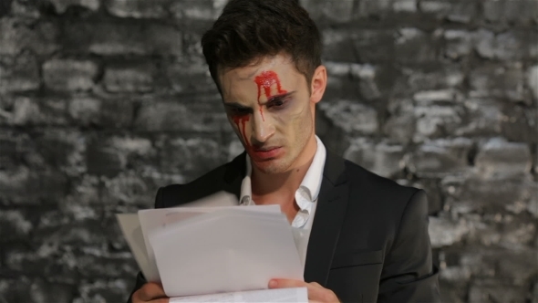 Vampire Reads And Tears Paper In Anger alt