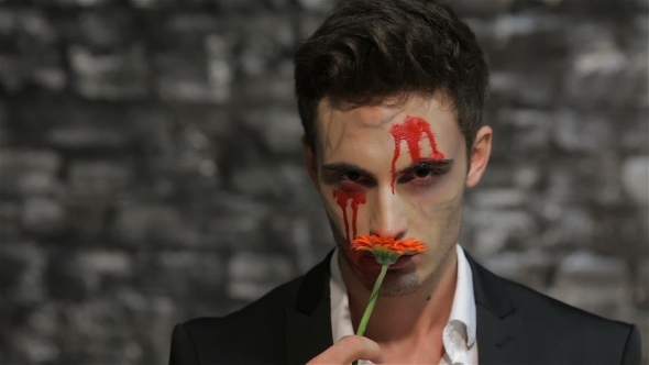 Male Vampire Smelling a Flower